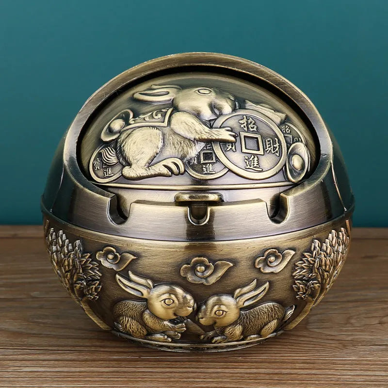 Creative alloy ashtray with smoke extinguishing slot in bronze finish featuring a Dragon and Phoenix design.