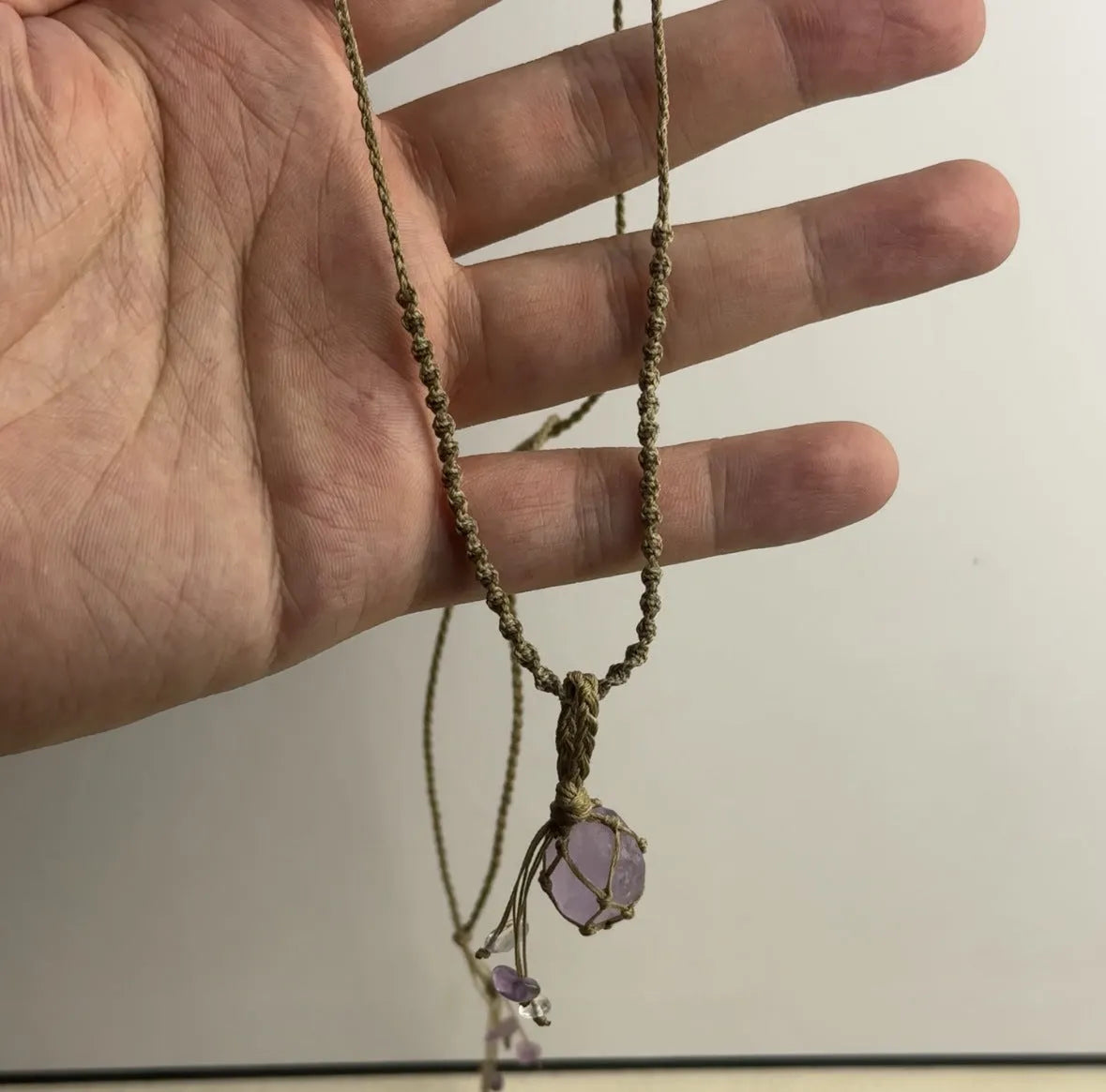 Artificial crystal rough labradorite-style pendant necklace with O-link chain on display