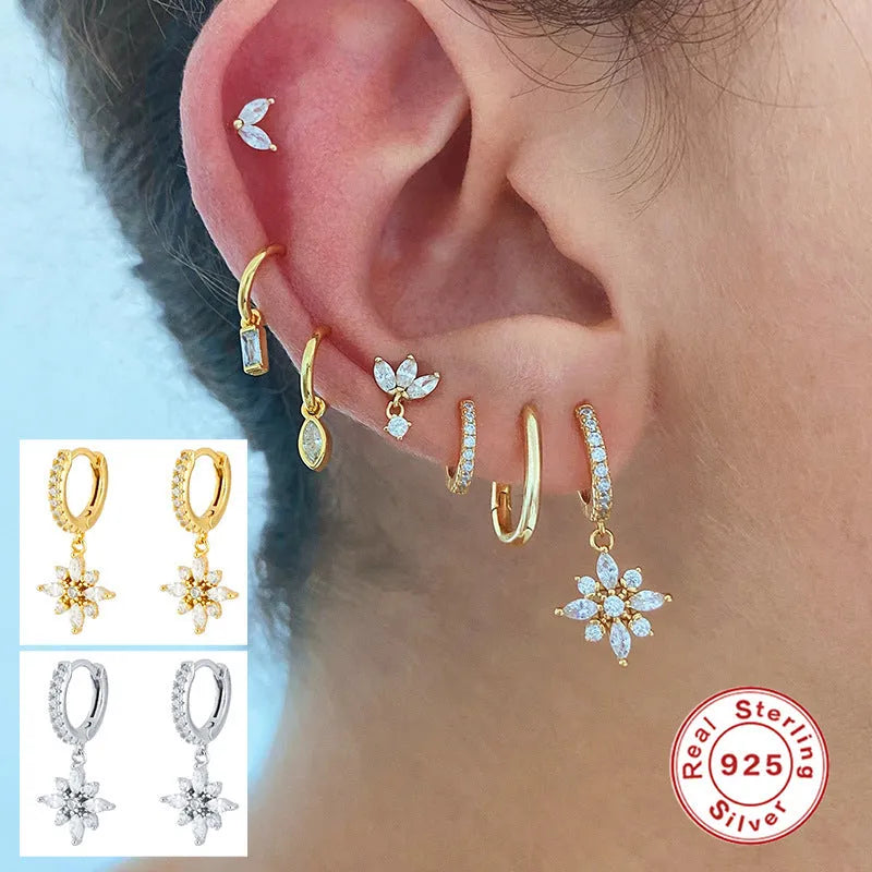 Sterling silver snowflake pendant earrings showing geometric design with gold-colour finish options