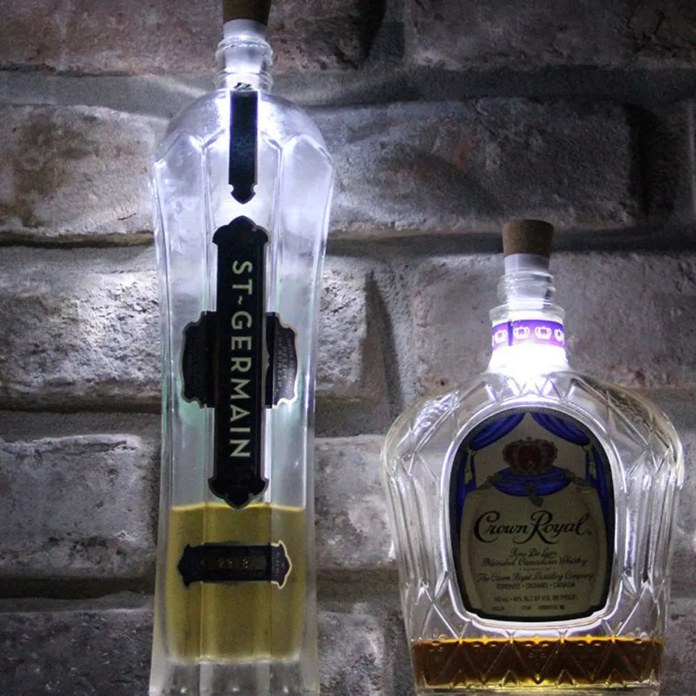 White plastic rechargeable LED cork light for bottle decoration, showing 15 LED beads.