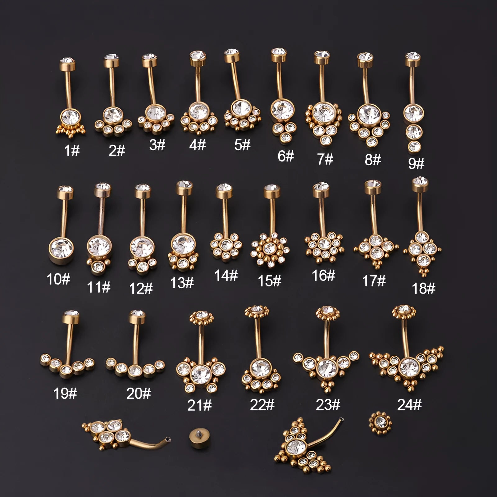 Gold stainless steel belly button ring with clear artificial gemstone inlay on white background