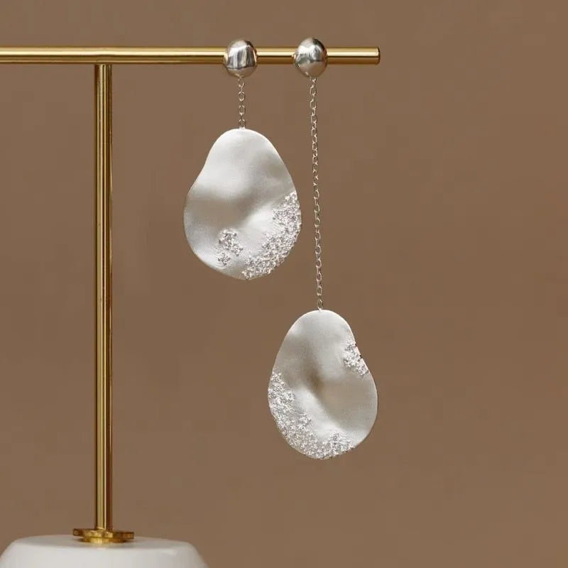 Asymmetric floral women's earrings with zircon stones in gold or silver finish, Chinese style design.