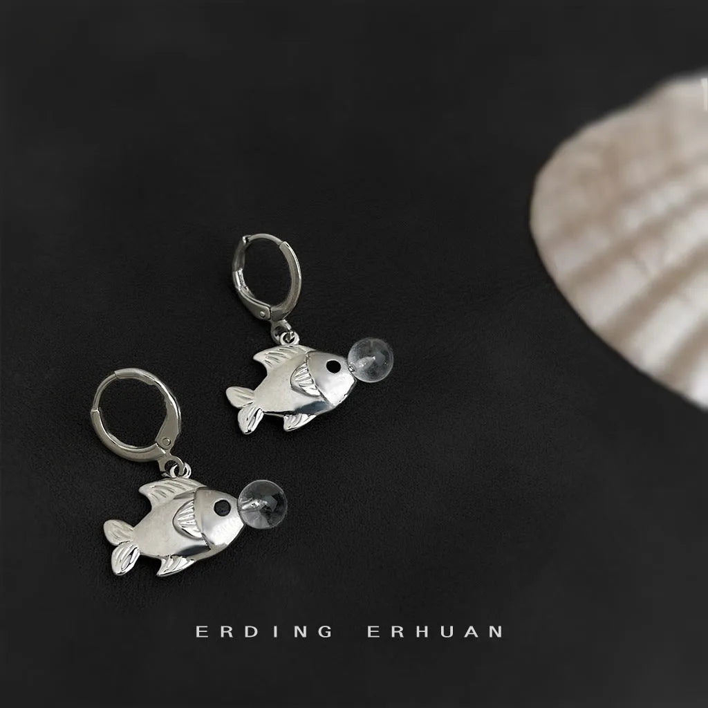 A pair of goldfish-inspired bubble fish design earrings with an electroplated finish on a copper base.