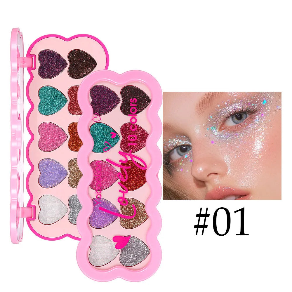 Pearlescent heart-shaped ten-colour sequin eye shadow palette showing shades of pink, blue, purple and brown.