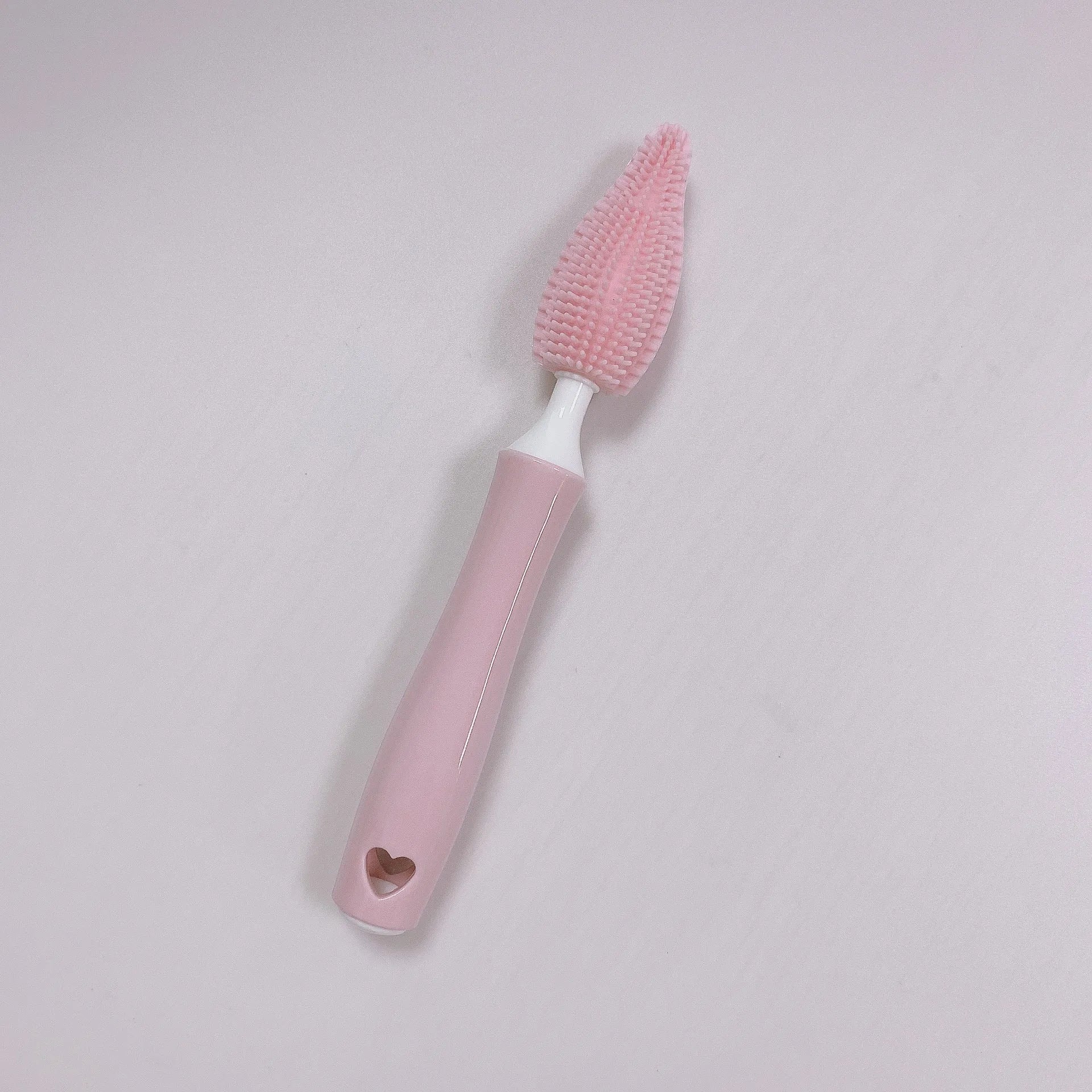Silicone baby bottle brush cleaning set in blue, pink, and yellow colours