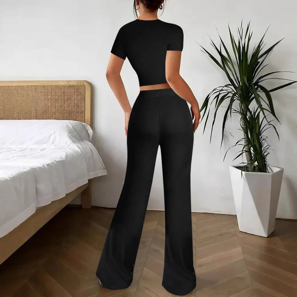 Women's black high waist trousers and short sleeve T-shirt two piece suit on hanger