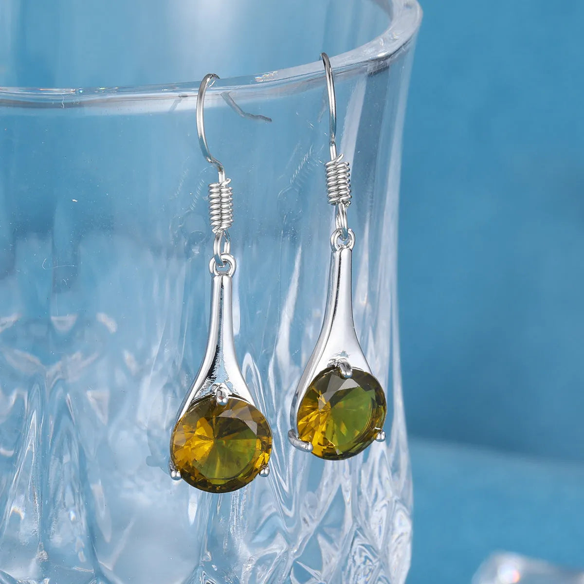 Olive green topaz drop shape earrings with minimalist design and electroplated finish
