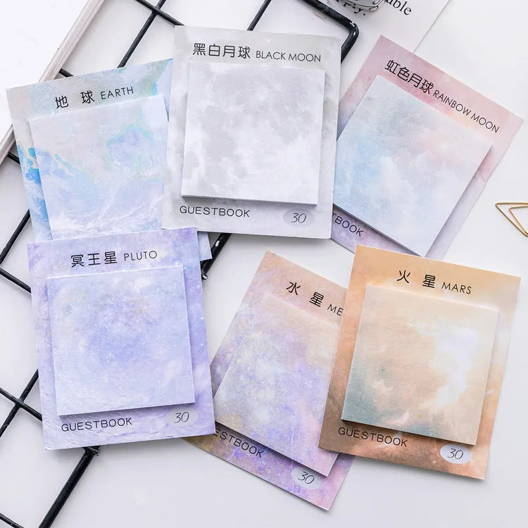 Square planet-themed sticky notes notepad showing oil painting designs of moon, earth, and mars