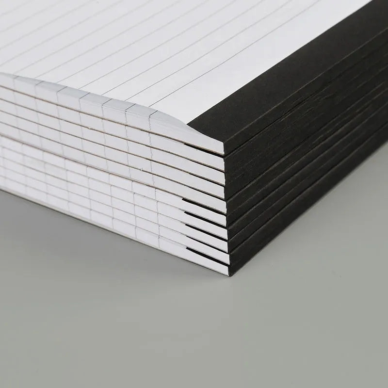 A4 tearable notebook with grid paper and wireless adhesive binding, shown in ivory white.