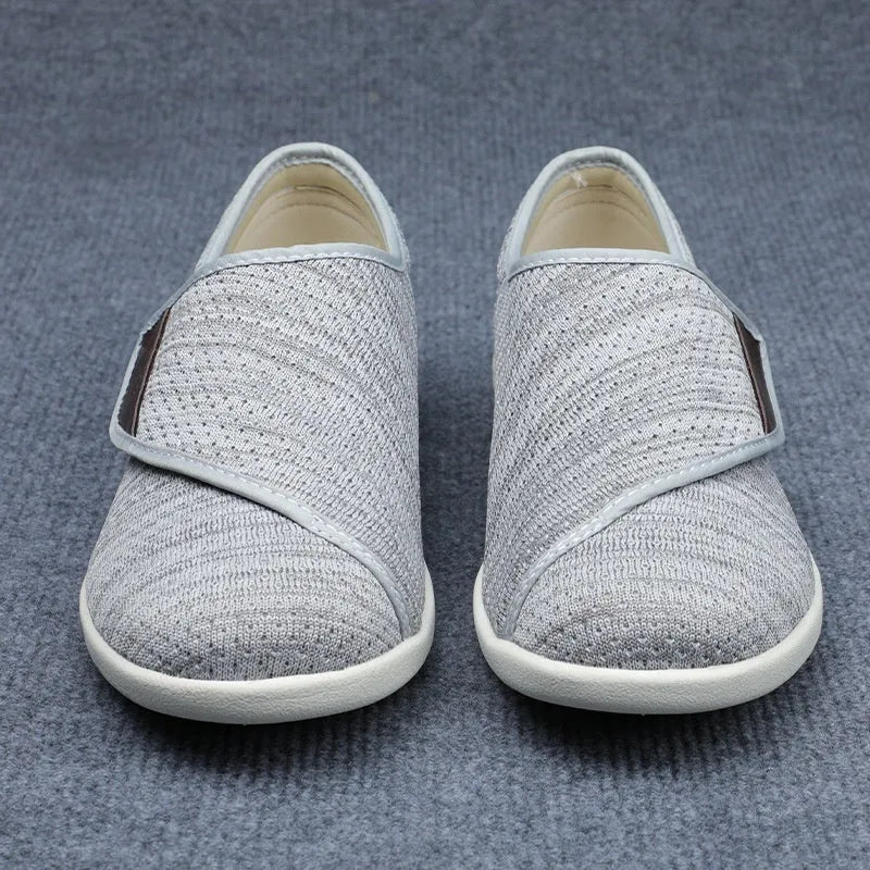 Casual beige leisure shoes with a velcro strap and round toe on a foam rubber sole.