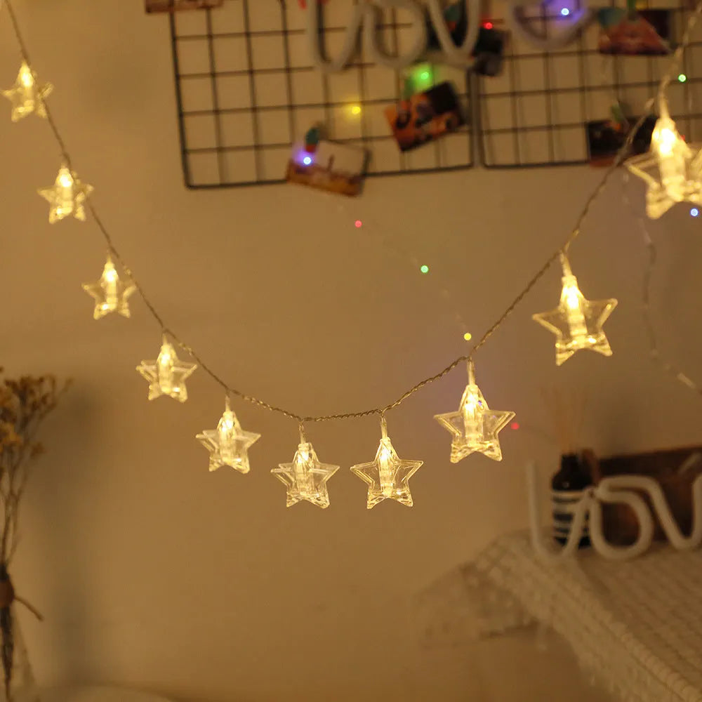 LED star clip festoon lights on a dark background showing warm white 3-metre string with 20 star-shaped lamps