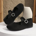 Black canvas fisherman shoes with rubber sole and low-top design