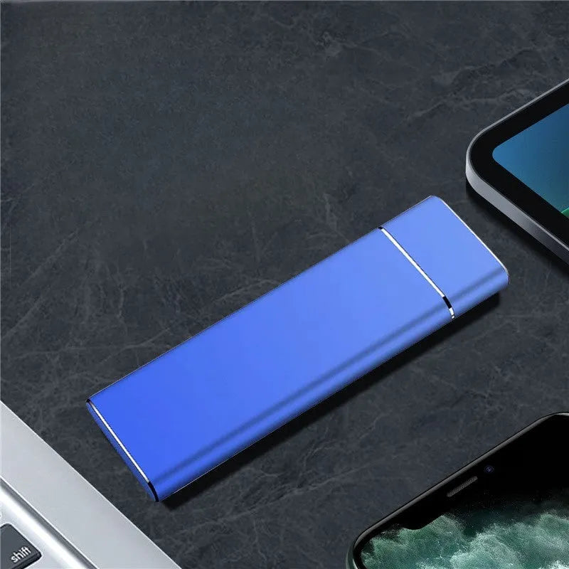Sapphire blue portable solid state hard drive with metal housing, USB cable and manual