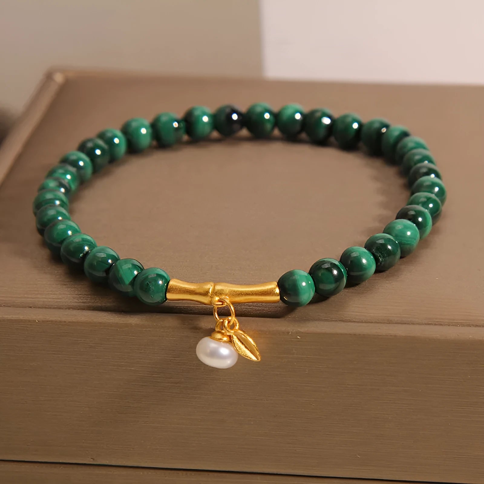 White crystal lucky bamboo bracelet with adjustable closure on a wrist.
