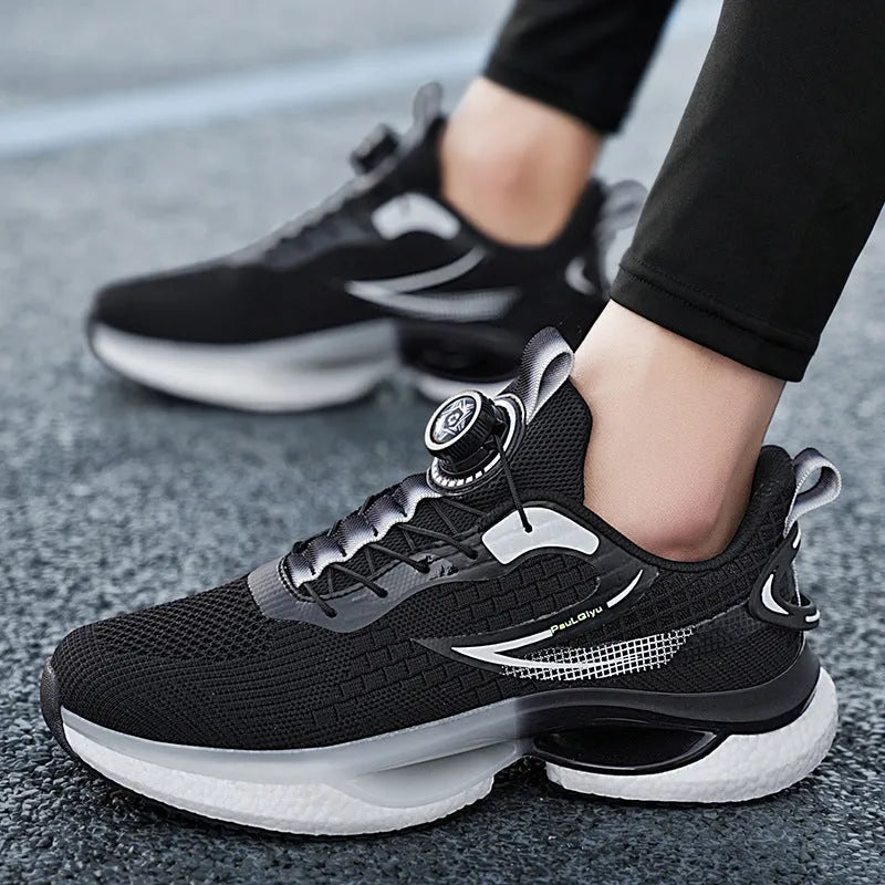 Men's white rotating button running shoes with mesh upper and buckle closure on a solid background.