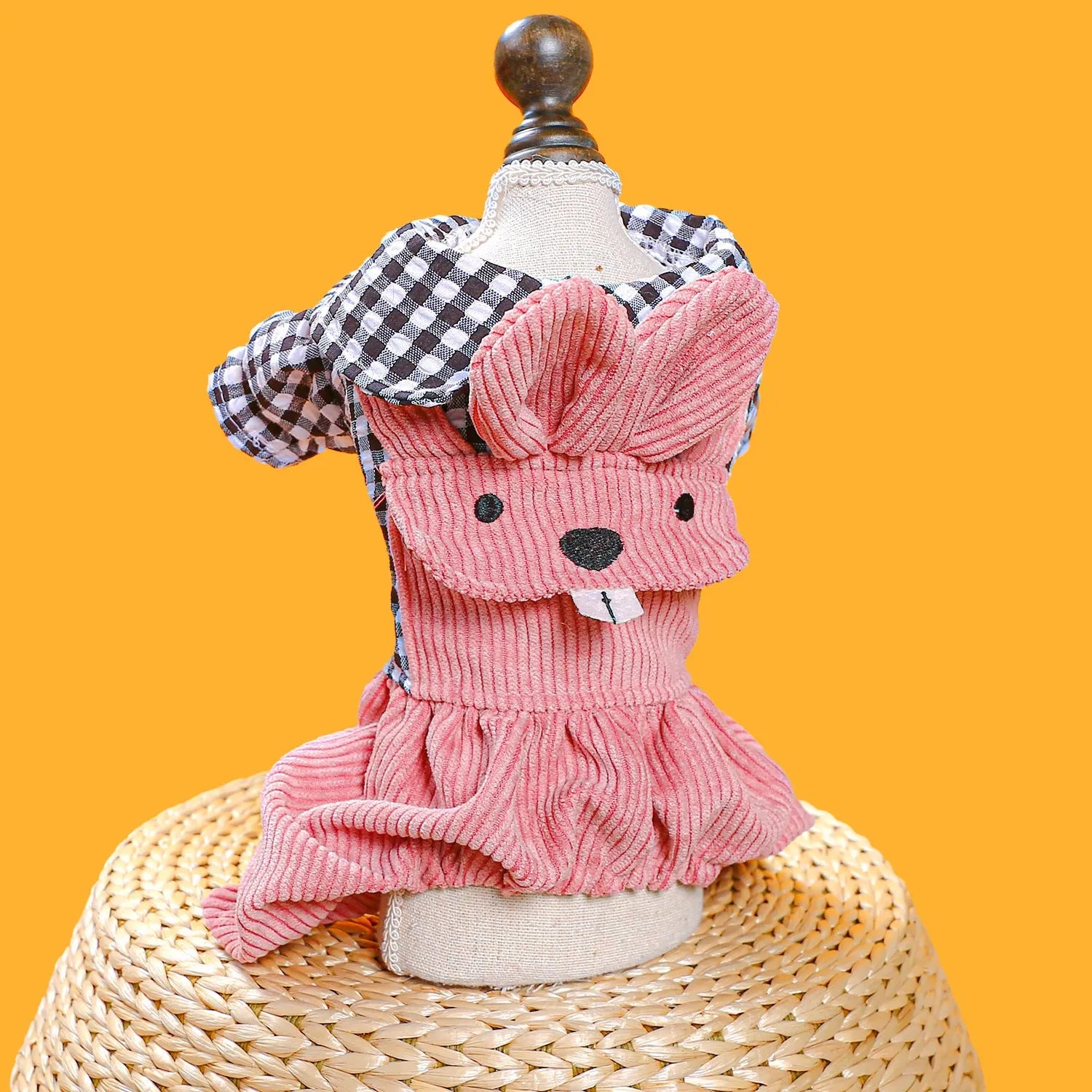 Four-legged plaid overalls for pets in polyester, black grid top, shown on a dog indoors
