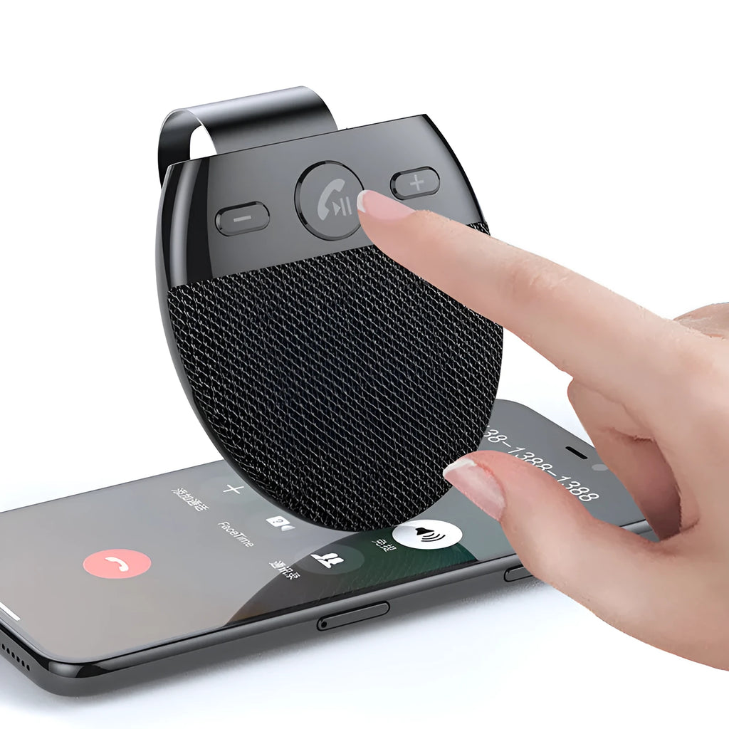 Bluetooth car handsfree device clipped to a car sun visor with black finish