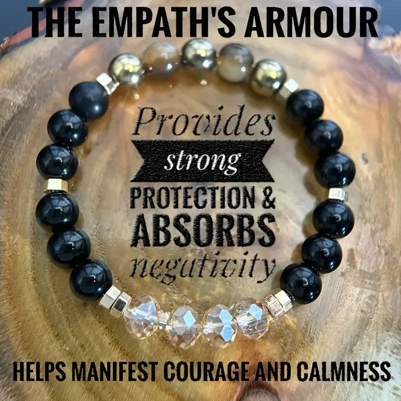Close-up of a multi-element natural stone bracelet with tigereye, obsidian, red tiger stone, and gold geometric beads