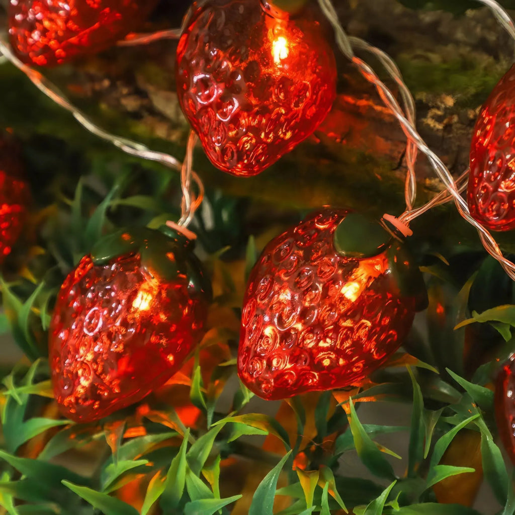 Warm strawberry-shaped LED string lights with IP66 protection, available in lengths from 1.5 m to 22 m.