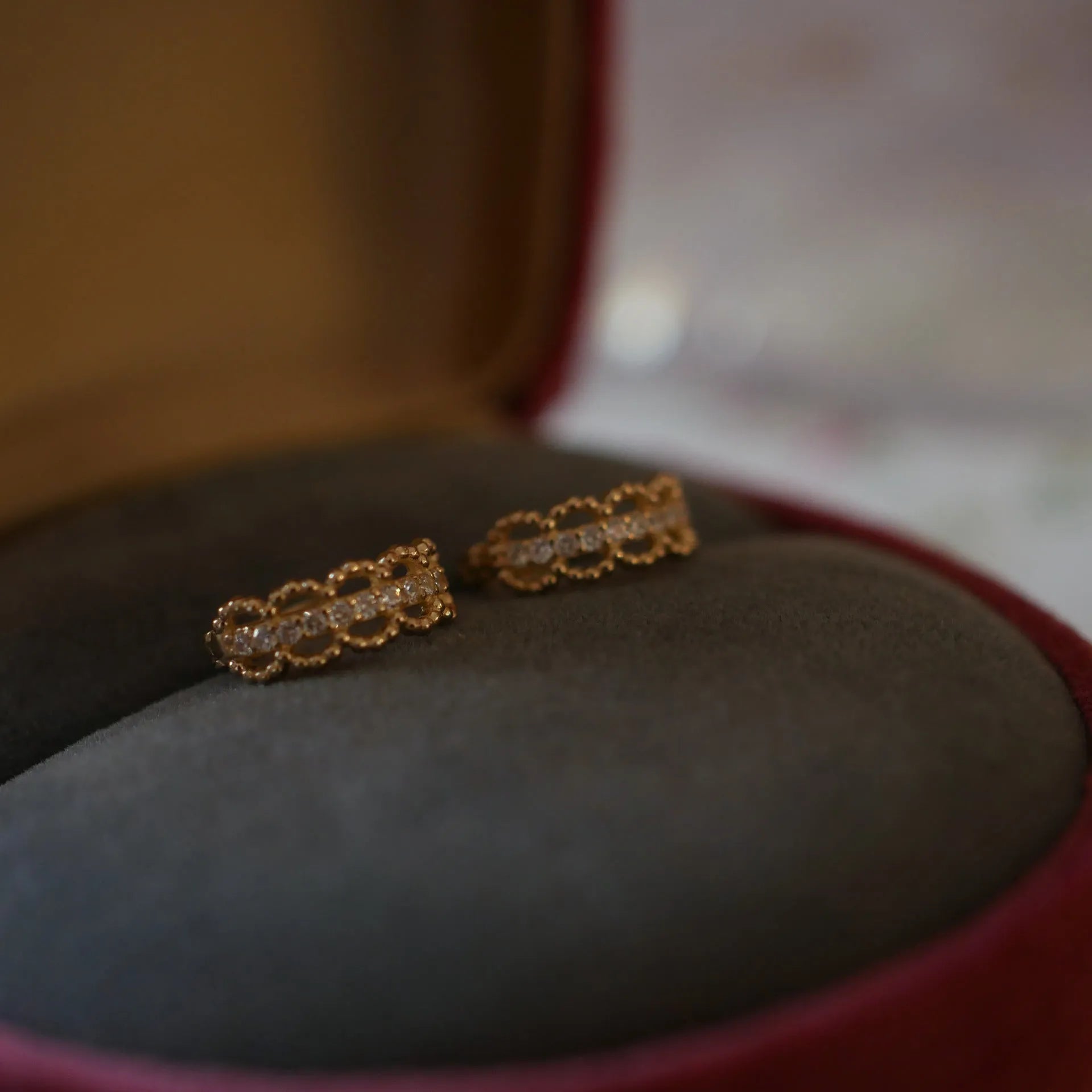Small gold lace bone stud earrings with clip backing, made from 925 silver.
