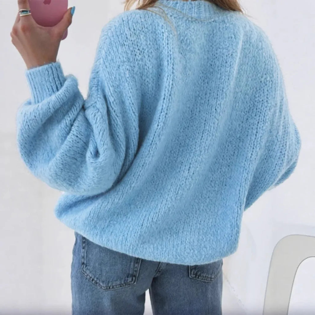 Blue round neck pullover sweater with long sleeves and loose fit, available in sizes S to XL.