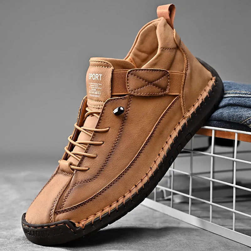 Men's mid-top Martin boot in khaki with tooling stitching and an elastic band ankle closure.
