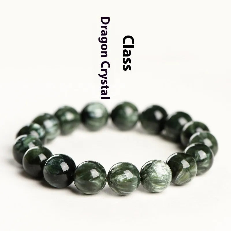 Green Dragon Crystal round bead bracelet with Ruyi design elements on a wrist.