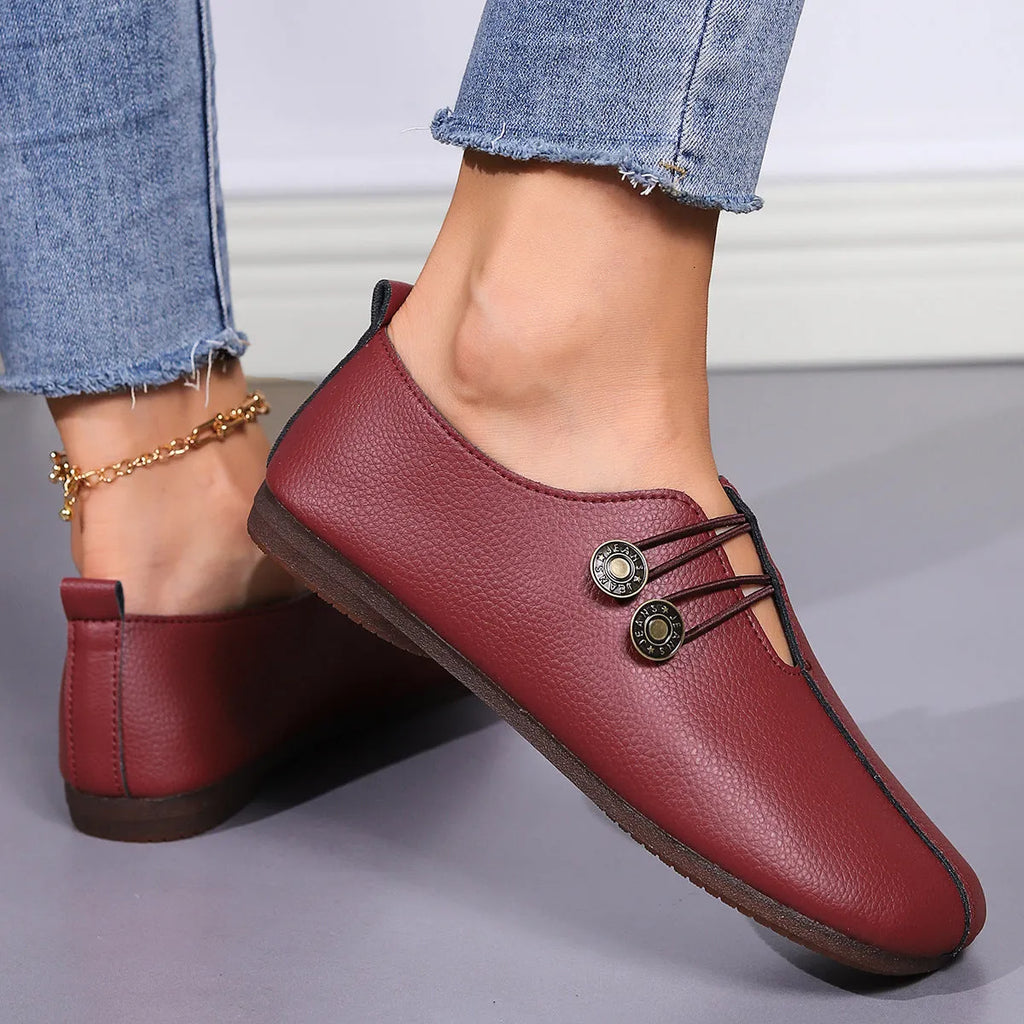 Women's casual square toe slip-on flats in beige with button detail on a white background