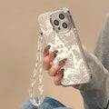 Transparent three-in-one mirror iPhone case with bow bracelet attachment for iPhone 15 Pro Max
