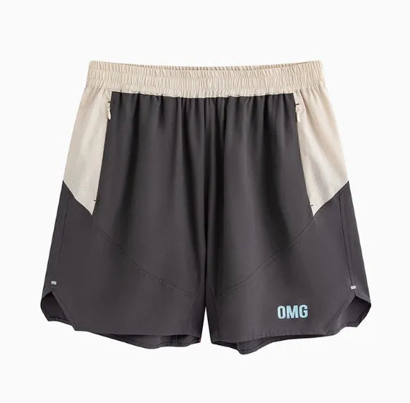 Man's loose grey workout shorts with elastic waist and white lace-up fly front.