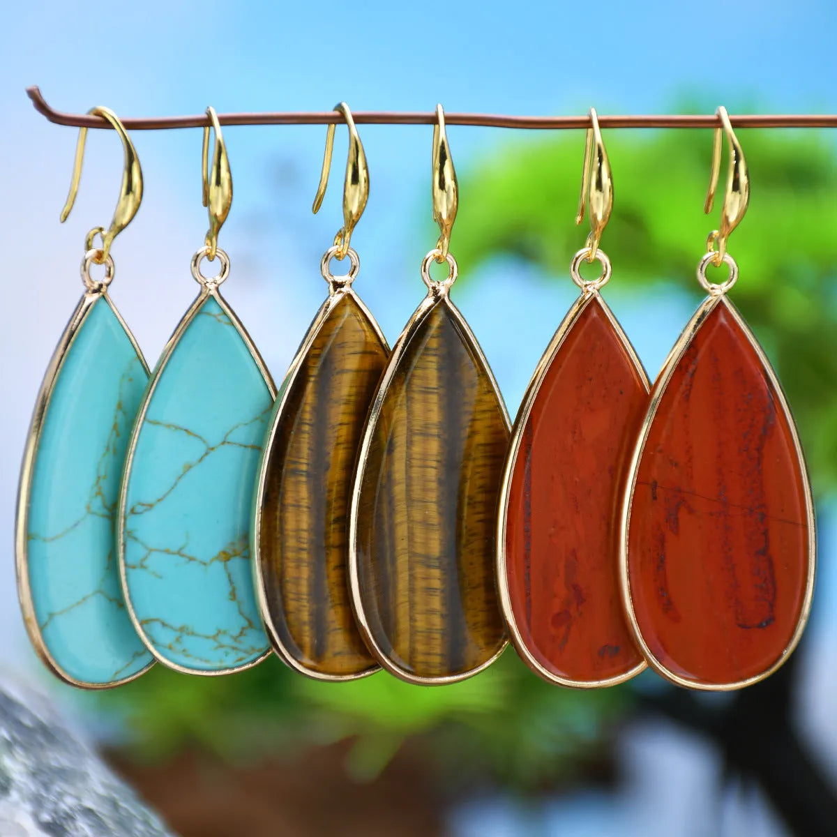 Handmade vintage long water drop earrings in Tigereye stone with textured details