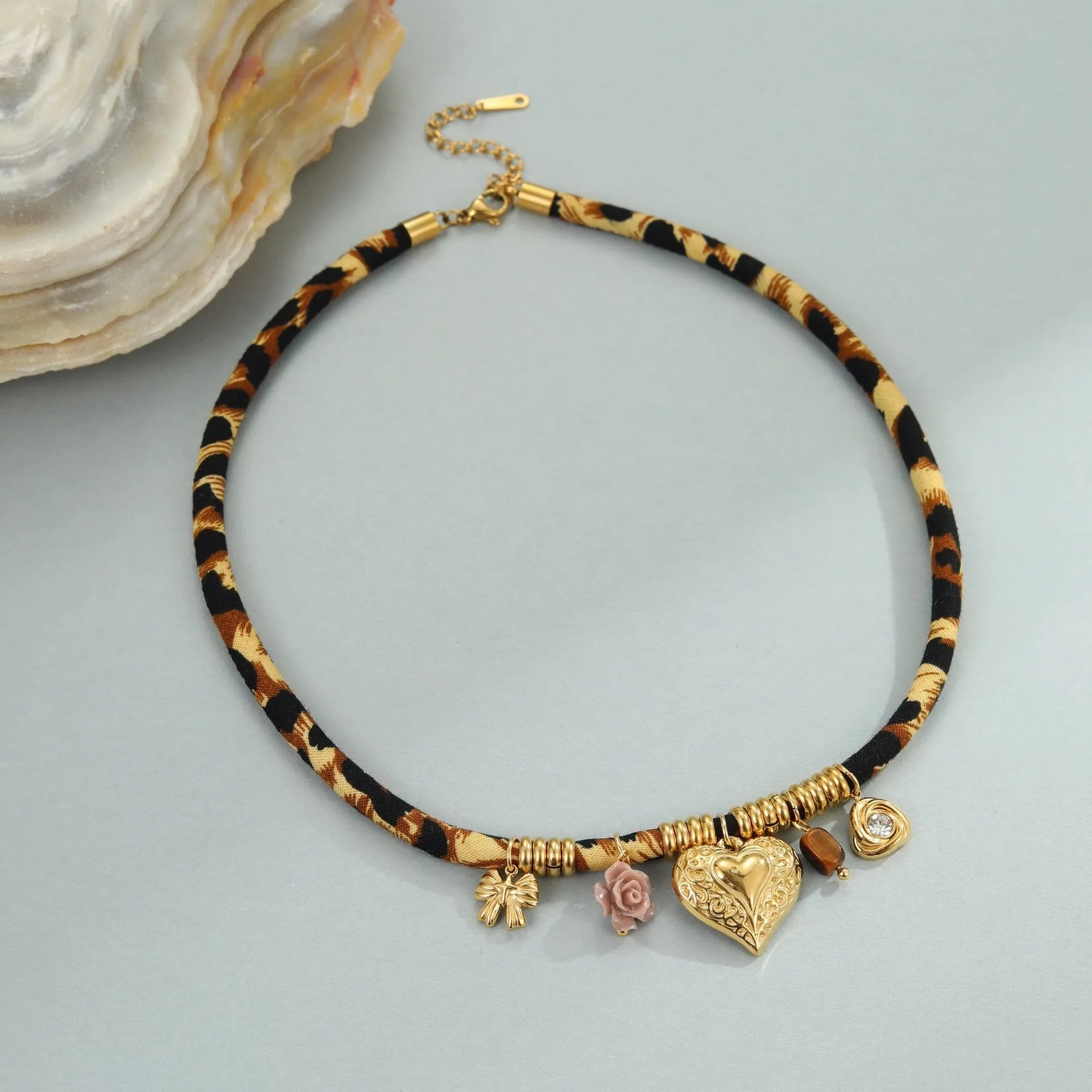 Leopard series stainless steel necklace with geometric pendant on a gold-colour chain