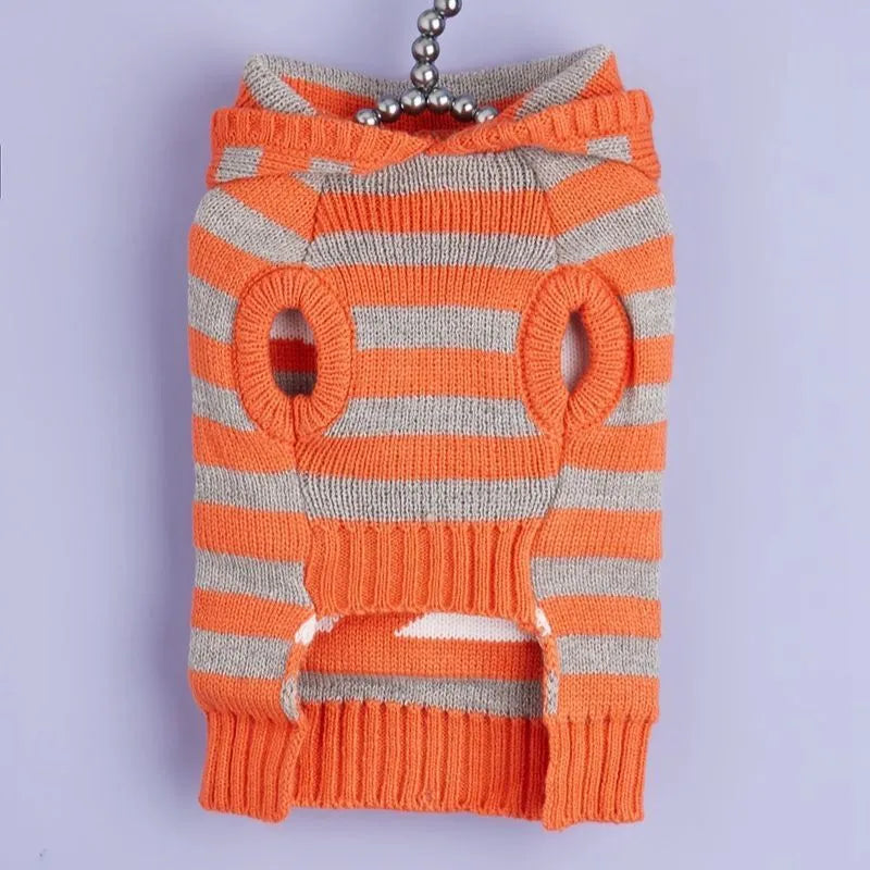 Orange and black striped knitted hooded sweater for dogs or cats with fur ball details.