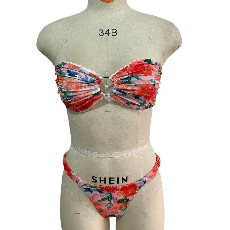 Colourful floral print bikini set with tube top and briefs on a hanger.