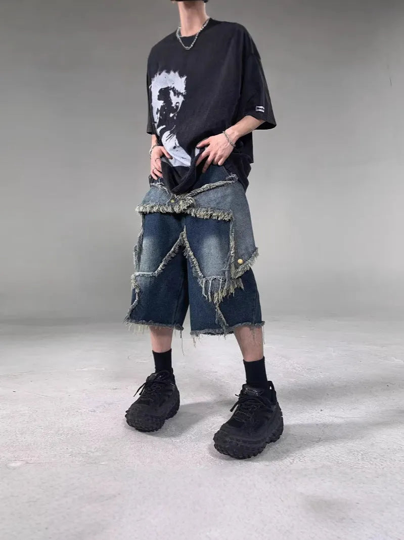 Blue cotton men's denim shorts with frayed hem and embroidered star, loose fit style.