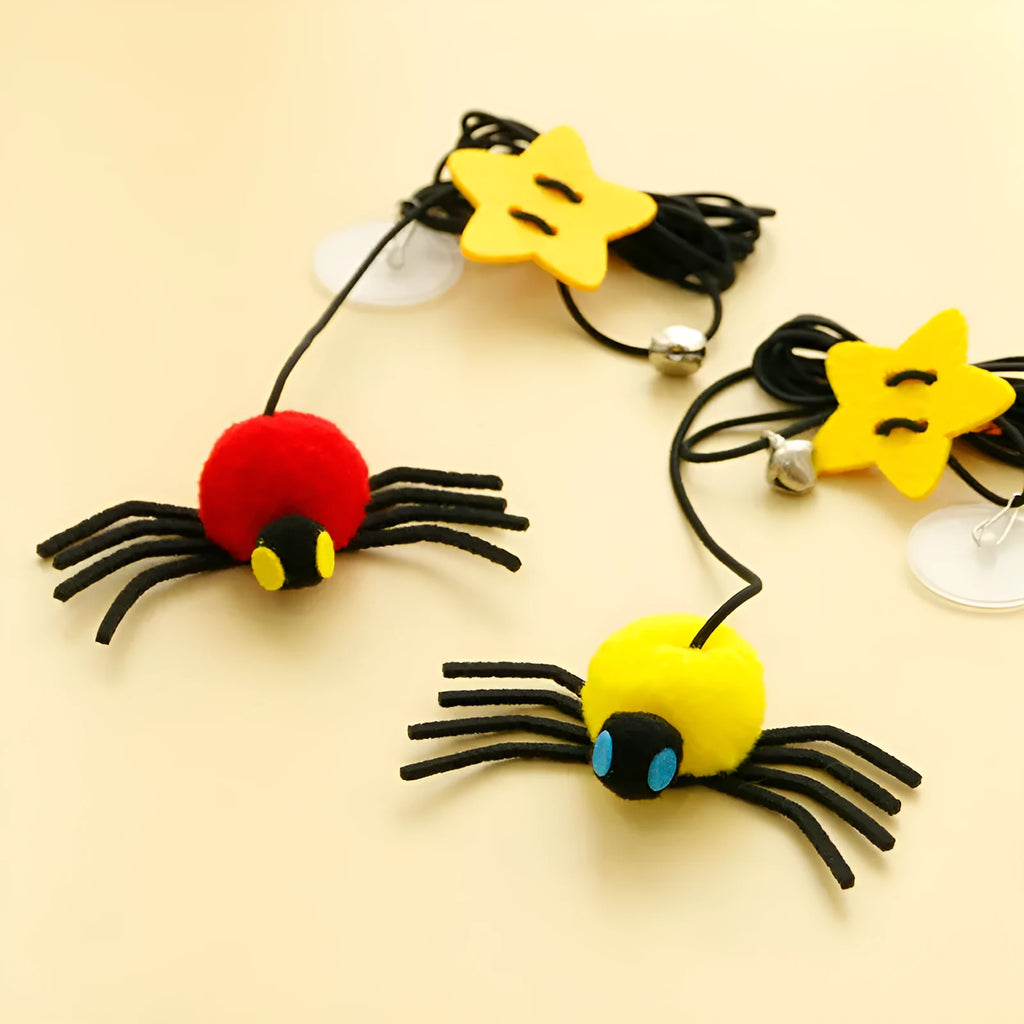 Red and yellow cat hanging door toy with elastic rope, feather stick, bell, and spider attachment.